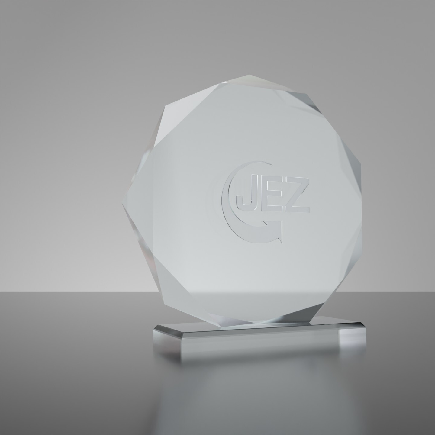 Ein runder Award aus Glas mit eingraviertem JEZ-Logo